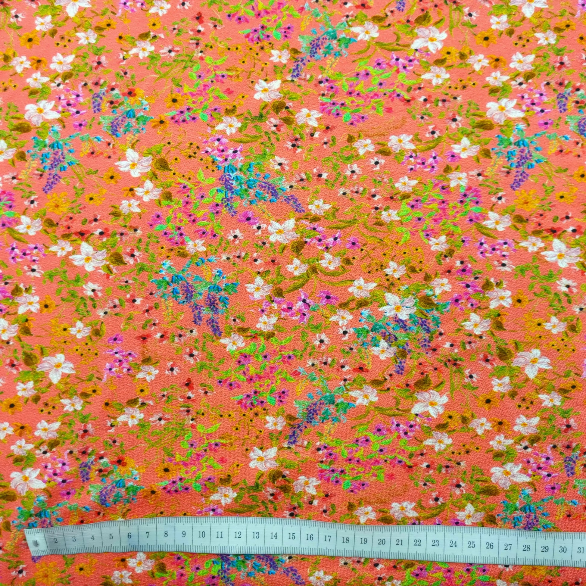 Viskosejersey mit Blumen Lachsfarbe CSM-STOFFE